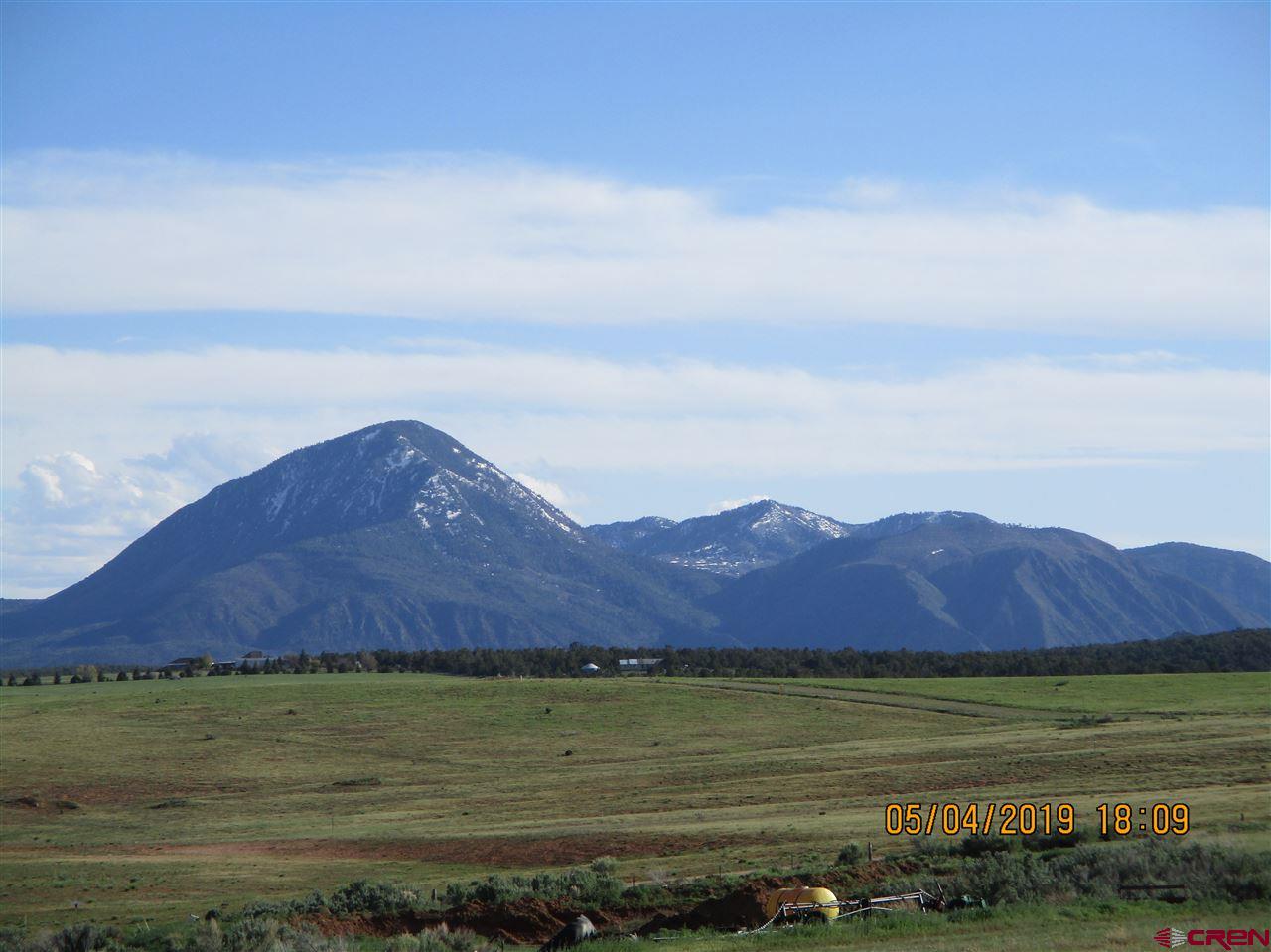 Lot 11 Road 17.9 Cortez Co 81321 Cortez, CO 81321 - Photo 2 of 17 a view of an ocean and mountain