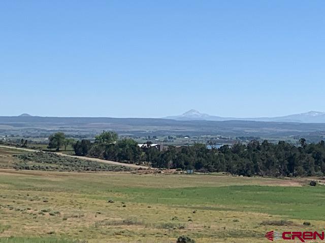 Lot 11 Road 17.9 Cortez Co 81321 Cortez, CO 81321 - Photo 8 of 17 a view of a lake with beach and mountain view