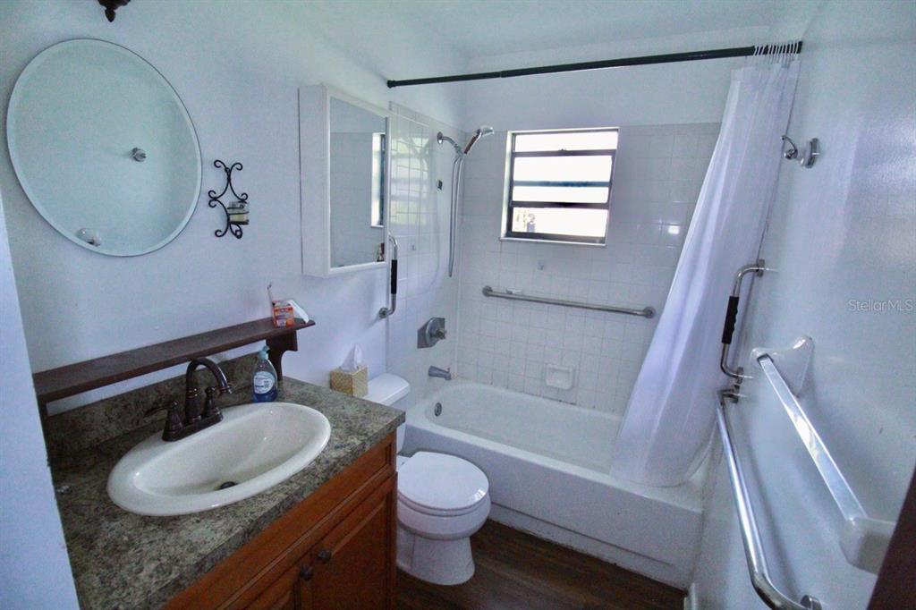 4090 Old Colony Road Mulberry, FL 33860 - Photo 14 of 22 a bathroom with a granite countertop sink toilet and shower
