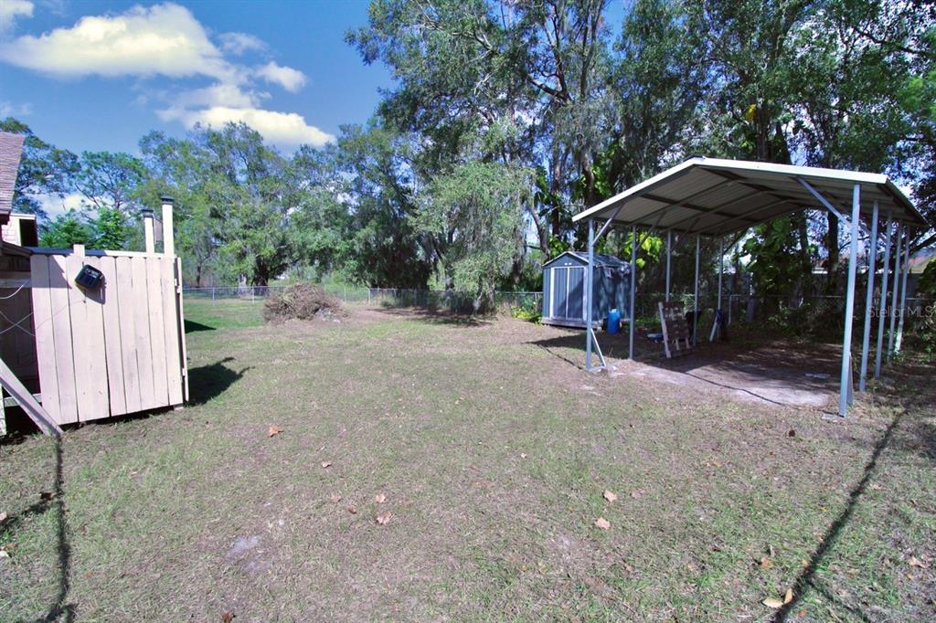 4090 Old Colony Road Mulberry, FL 33860 - Photo 19 of 22 a view of a wooden house with a yard
