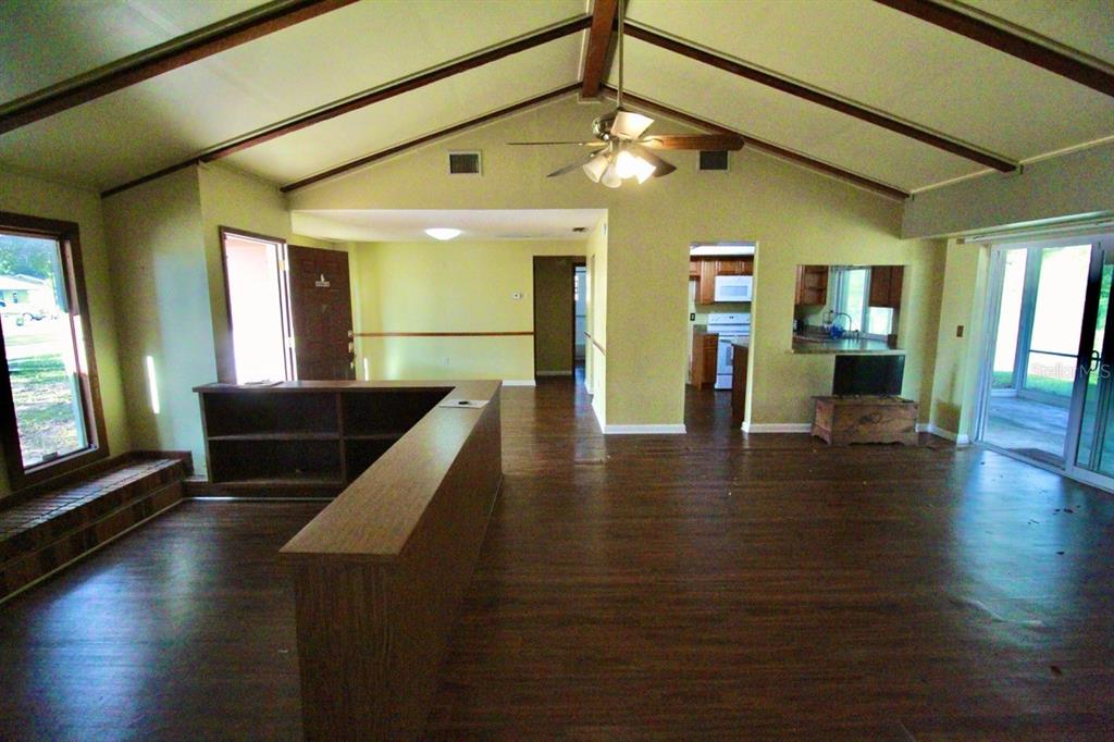 4090 Old Colony Road Mulberry, FL 33860 - Photo 2 of 22 an open kitchen with furniture and wooden floor