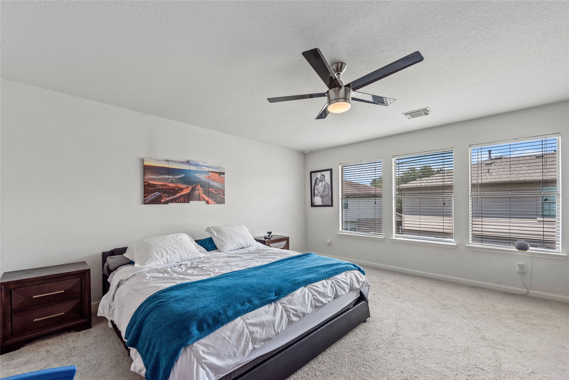 17142 Carshalton Court Houston, TX 77084 - Photo 16 of 21 a bedroom with a large bed and a window
