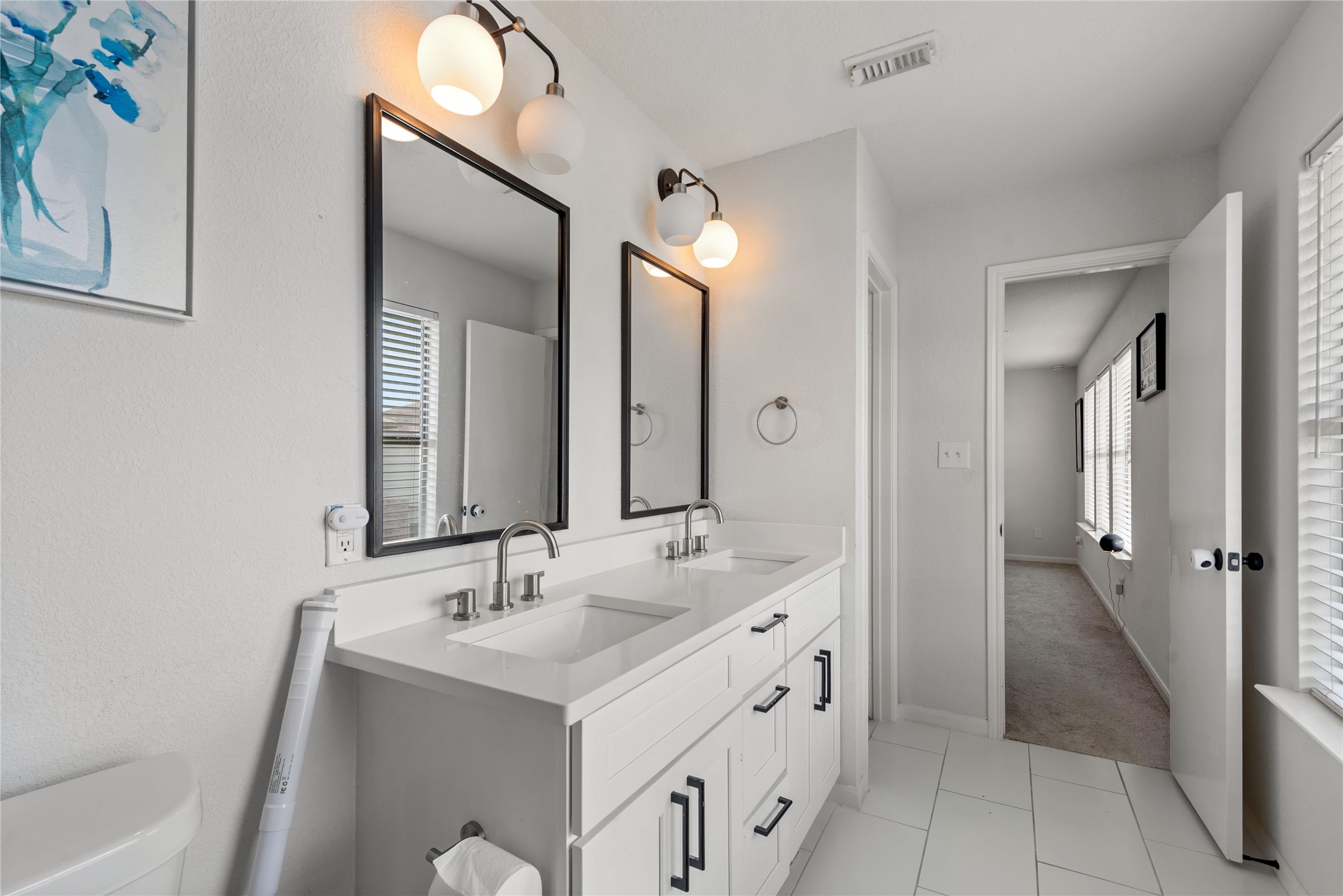 17142 Carshalton Court Houston, TX 77084 - Photo 19 of 21 a bathroom with a double vanity sink mirror and double