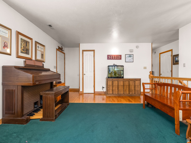 598 West 1600th Street North Mapleton, UT 84664 - Photo 5 of 34 Living room with light wood-style floors, carpet, and baseboards