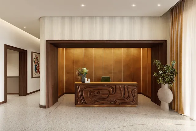 a living room with a couch and a potted plant