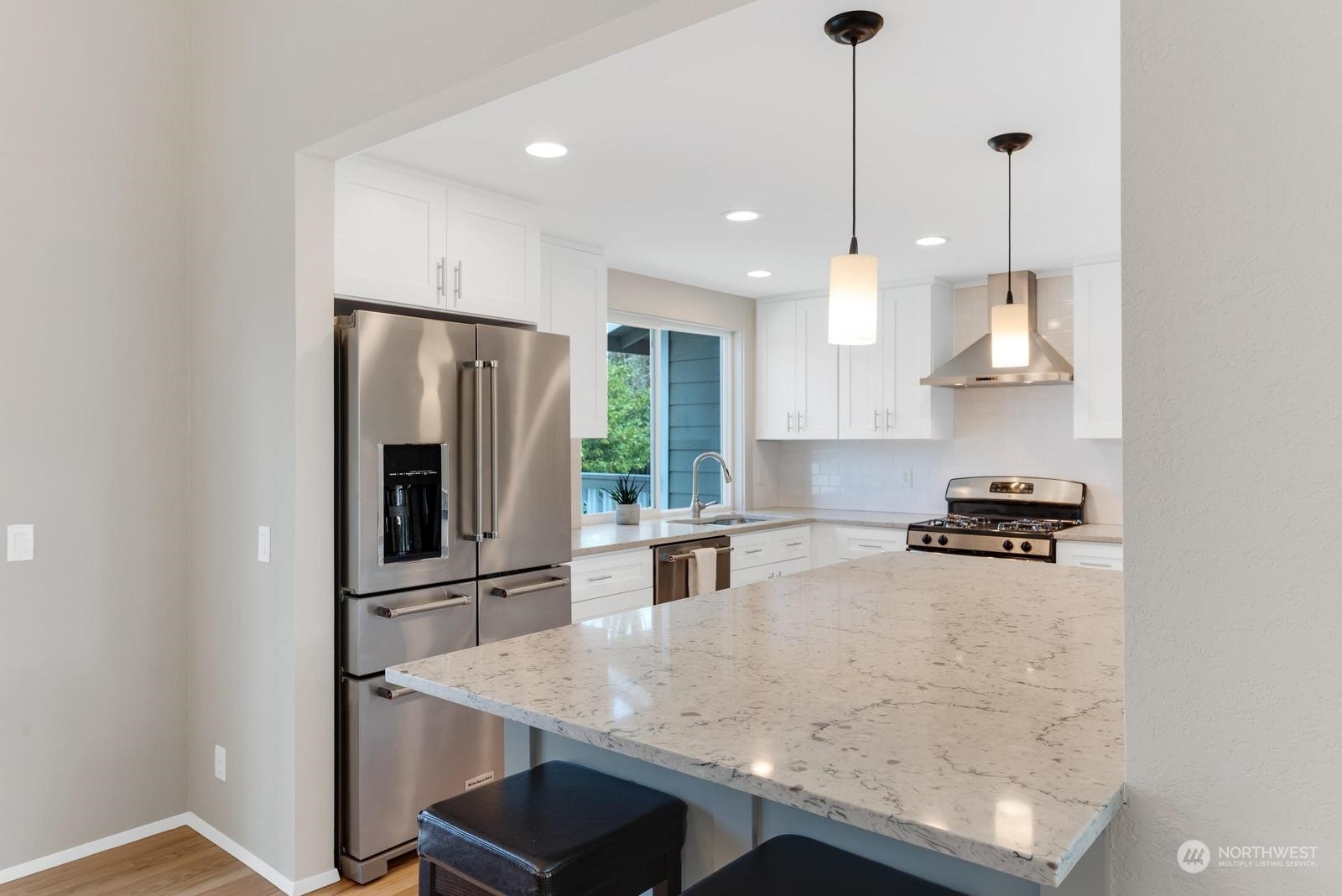 2403 166th Place Southeast Bothell, WA 98012 - Photo 13 of 29 a kitchen with stainless steel appliances granite countertop a sink refrigerator and stove