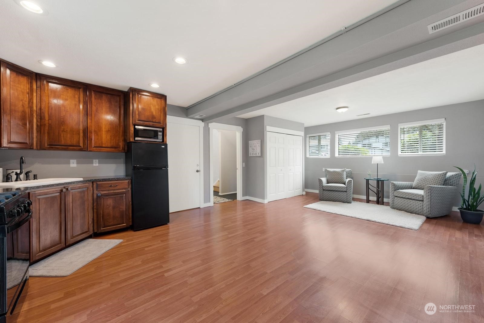 2403 166th Place Southeast Bothell, WA 98012 - Photo 23 of 29 a view of an empty room with window wooden floor and furniture