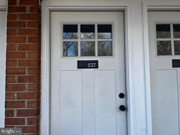 a view of a door and a window