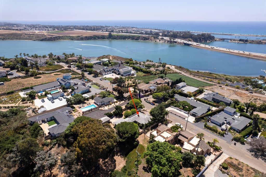 an aerial view of a city with ocean view