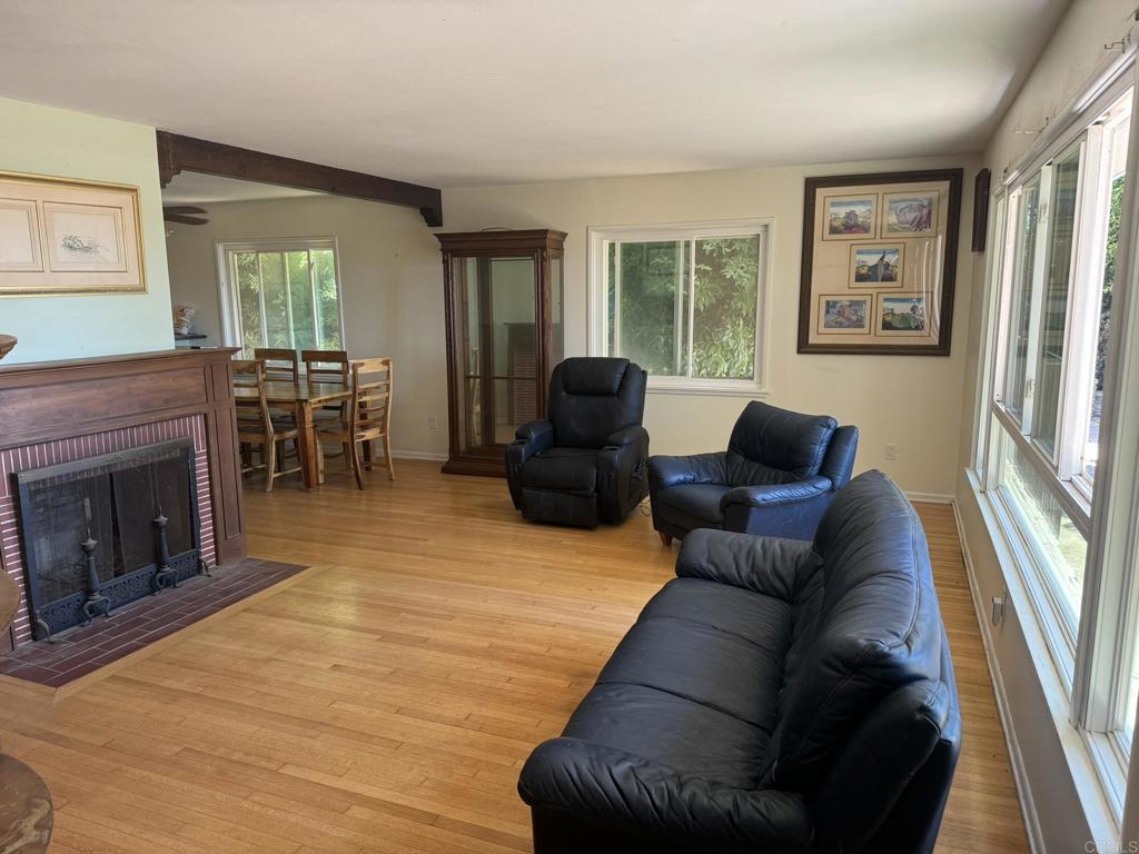 4340 Highland Drive Carlsbad, CA 92008 - Photo 18 of 28 a living room with furniture and a fireplace