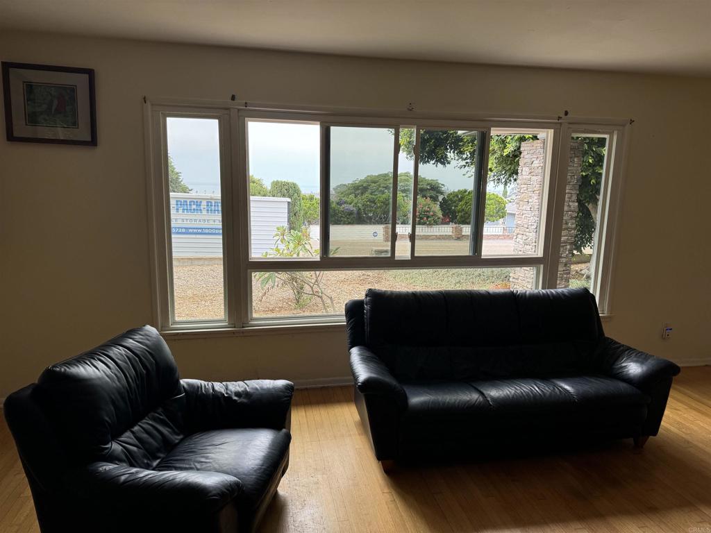 4340 Highland Drive Carlsbad, CA 92008 - Photo 21 of 28 a living room with furniture and a large window