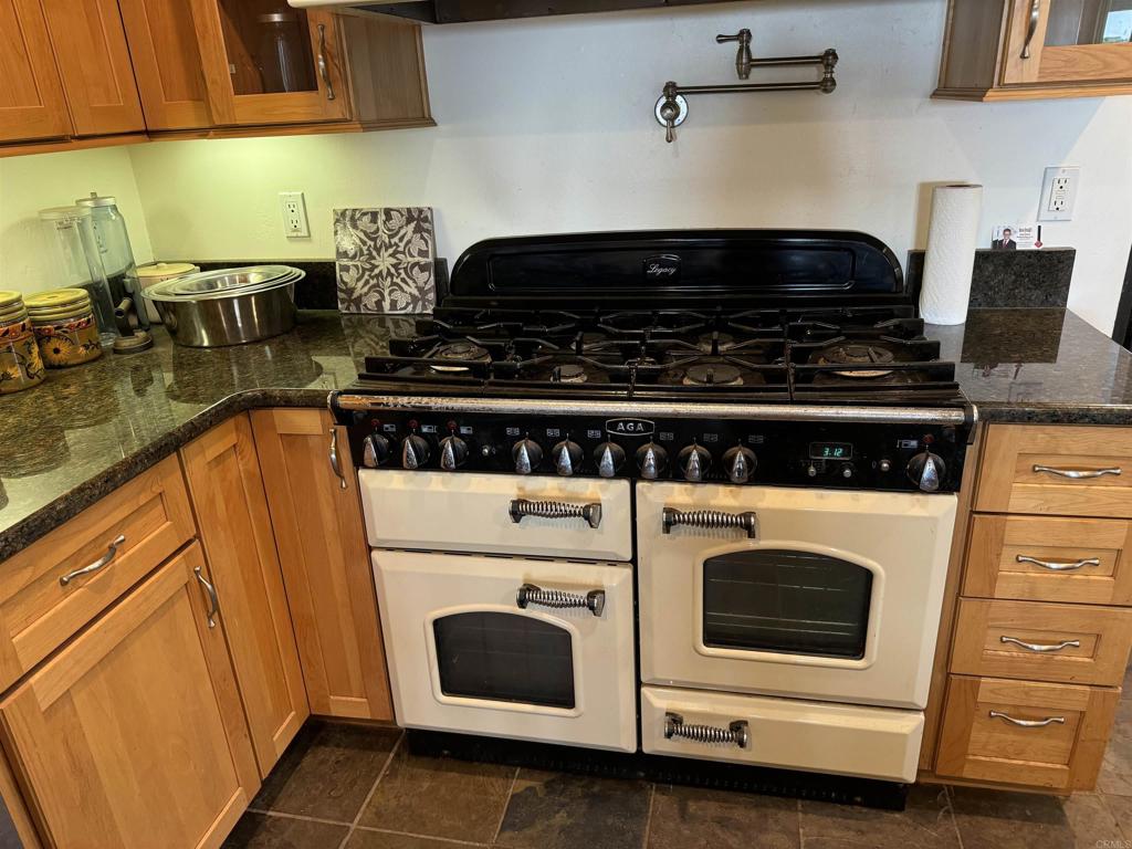 4340 Highland Drive Carlsbad, CA 92008 - Photo 22 of 28 a stove top oven sitting inside of a kitchen