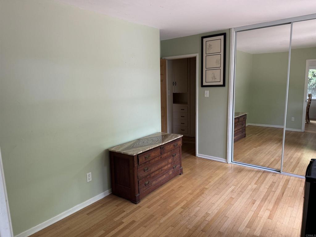 4340 Highland Drive Carlsbad, CA 92008 - Photo 23 of 28 an empty room with wooden floor cabinet and closet
