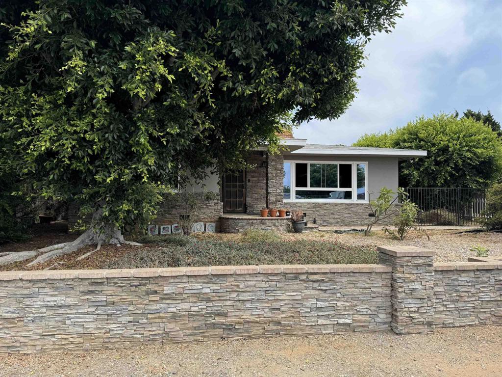 4340 Highland Drive Carlsbad, CA 92008 - Photo 27 of 28 a front view of a house with garden