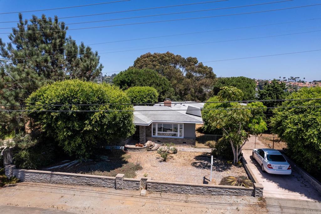 4340 Highland Drive Carlsbad, CA 92008 - Photo 4 of 28 front view of a house with a patio