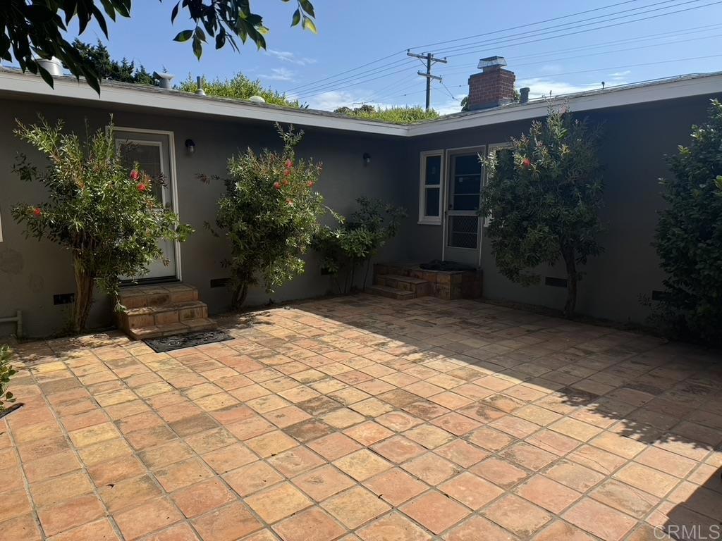4340 Highland Drive Carlsbad, CA 92008 - Photo 8 of 28 a backyard of a house with potted plants