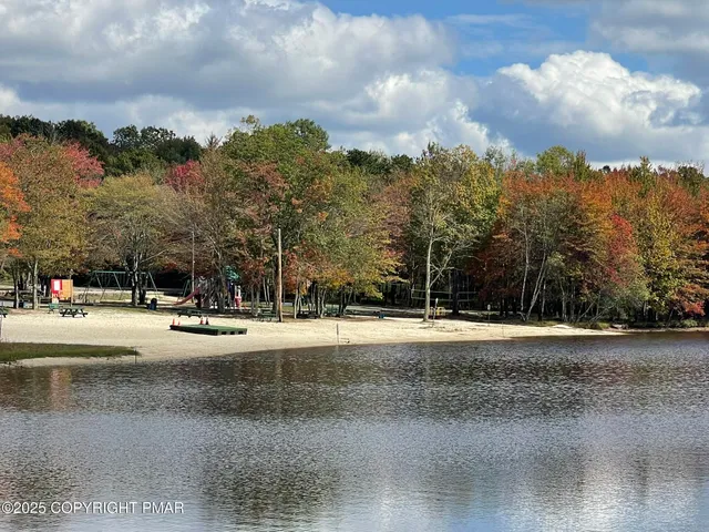 a view of a playground with a houses