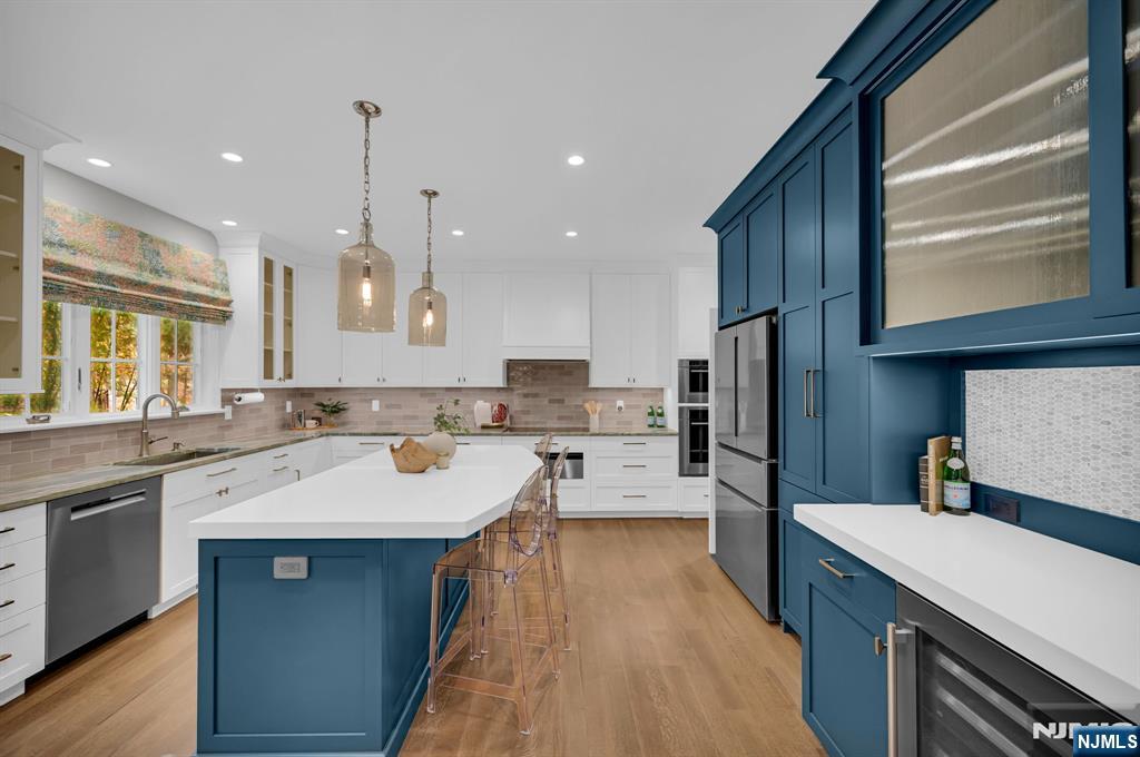 3 Brook Ridge Court Cedar Grove, NJ 07009 - Photo 19 of 49 a kitchen with a sink a counter top stainless steel appliances and cabinets