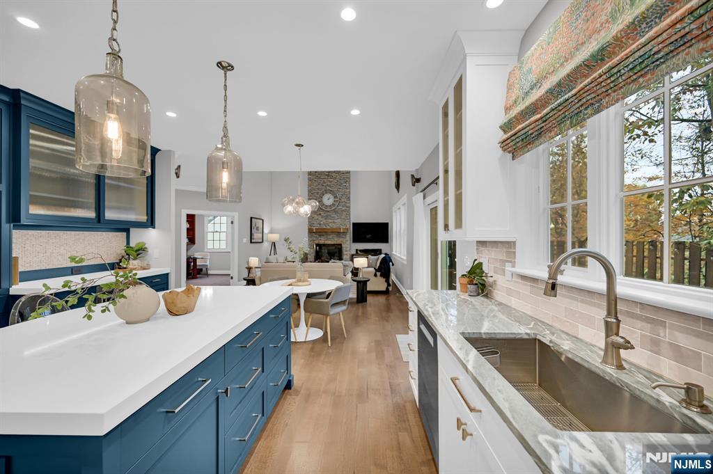 3 Brook Ridge Court Cedar Grove, NJ 07009 - Photo 21 of 49 a kitchen with a sink stove and cabinets