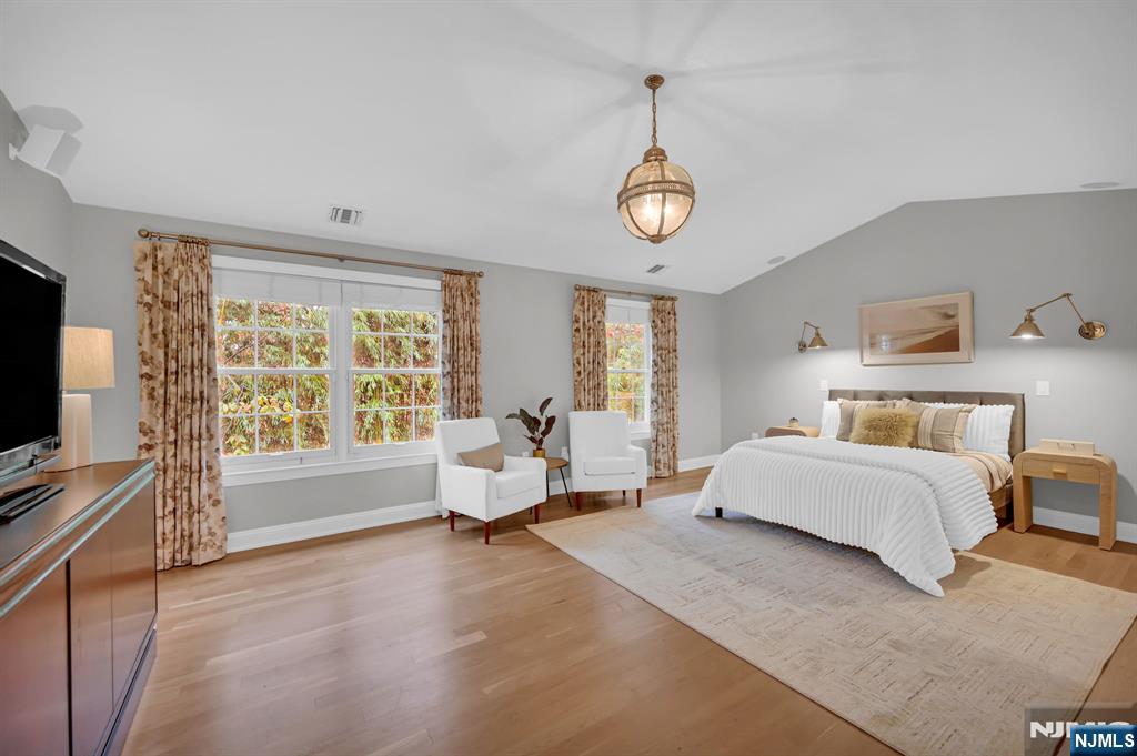 3 Brook Ridge Court Cedar Grove, NJ 07009 - Photo 23 of 49 a spacious bedroom with a bed and a large window