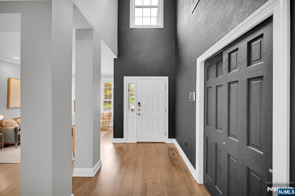 3 Brook Ridge Court Cedar Grove, NJ 07009 - Photo 3 of 49 a view of an entryway with wooden floor