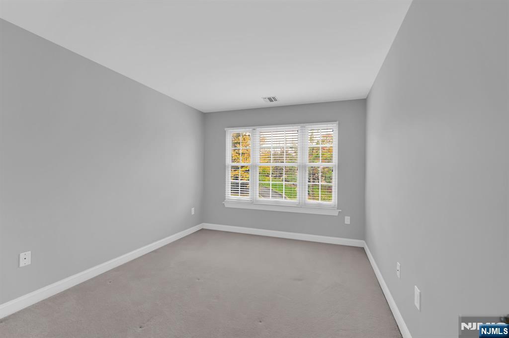 3 Brook Ridge Court Cedar Grove, NJ 07009 - Photo 31 of 49 an empty room with a window