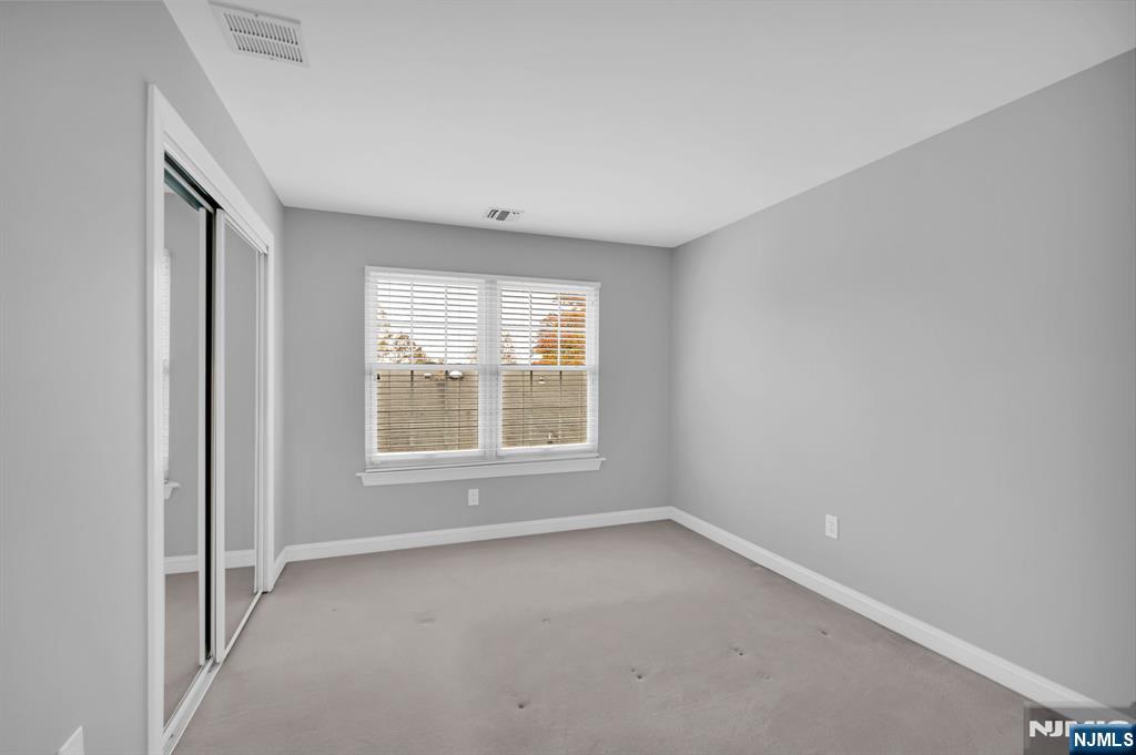 3 Brook Ridge Court Cedar Grove, NJ 07009 - Photo 33 of 49 an empty room with a window