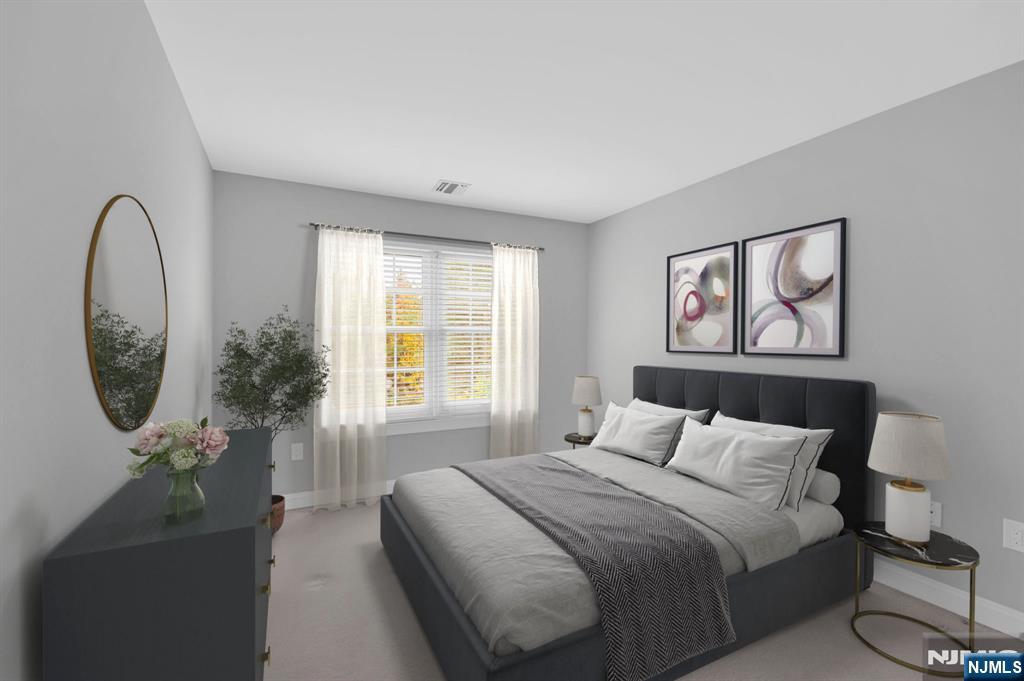 3 Brook Ridge Court Cedar Grove, NJ 07009 - Photo 34 of 49 a bedroom with a bed and a painting on the wall