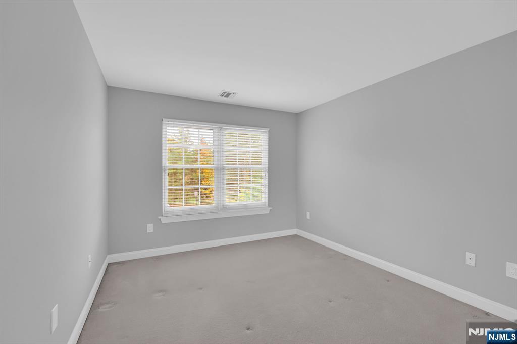 3 Brook Ridge Court Cedar Grove, NJ 07009 - Photo 35 of 49 an empty room with a window