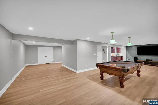 a view of a livingroom with workspace and a window