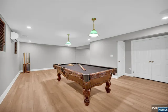 a room with wooden floor and couch