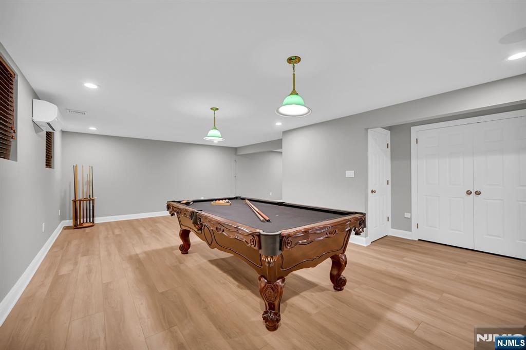 3 Brook Ridge Court Cedar Grove, NJ 07009 - Photo 38 of 49 a room with wooden floor and couch