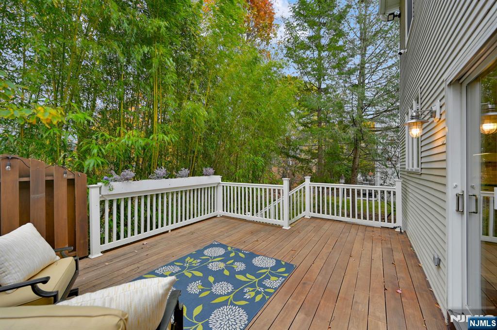 3 Brook Ridge Court Cedar Grove, NJ 07009 - Photo 43 of 49 a balcony with wooden floor and outdoor seating