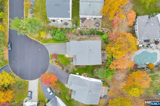 an aerial view of a house with a swimming pool