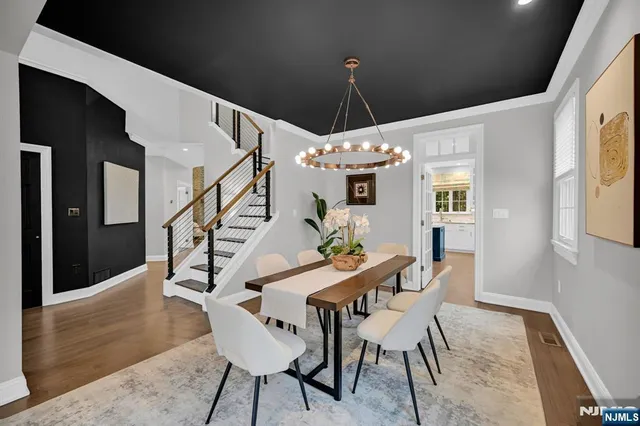a dining room with furniture and entryway