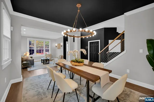 a dining room with furniture and wooden floor