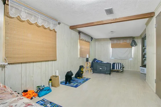 a bedroom with furniture and a window