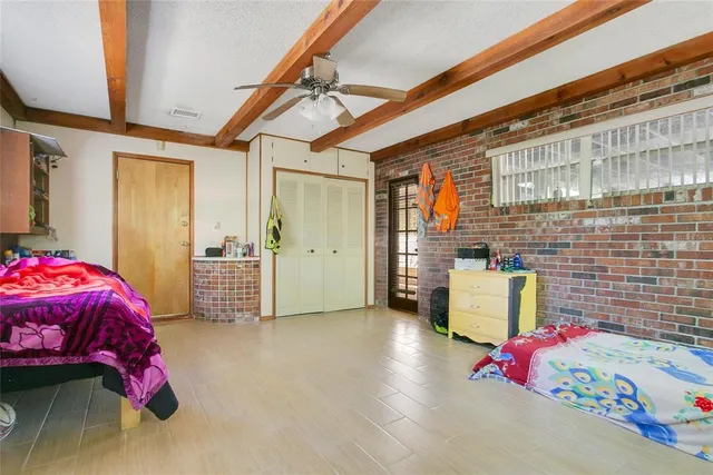 a bedroom with furniture and a window