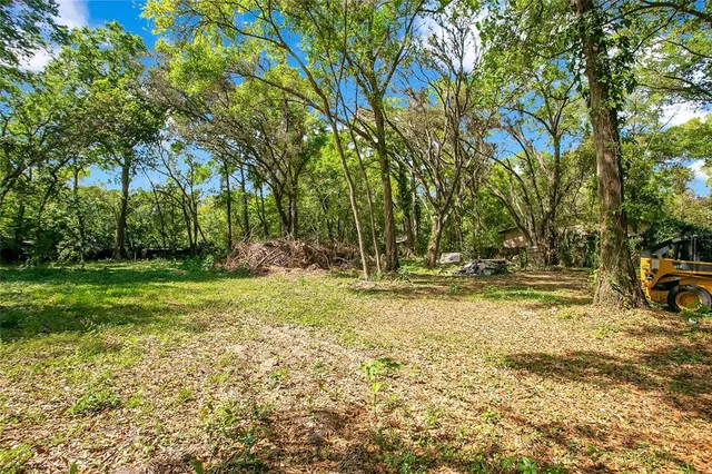 a view of a yard with swimming pool
