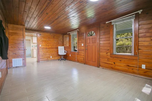 a view of an empty room with a window