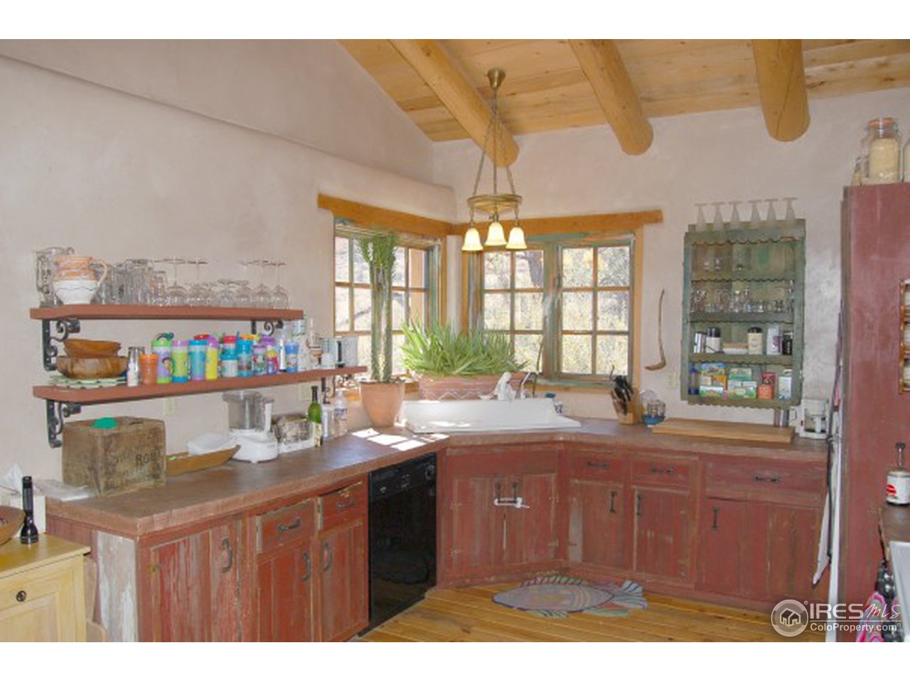 1016 Vision Way Lyons, CO 80540 - Photo 2 of 13 a kitchen with a sink and a wooden floor