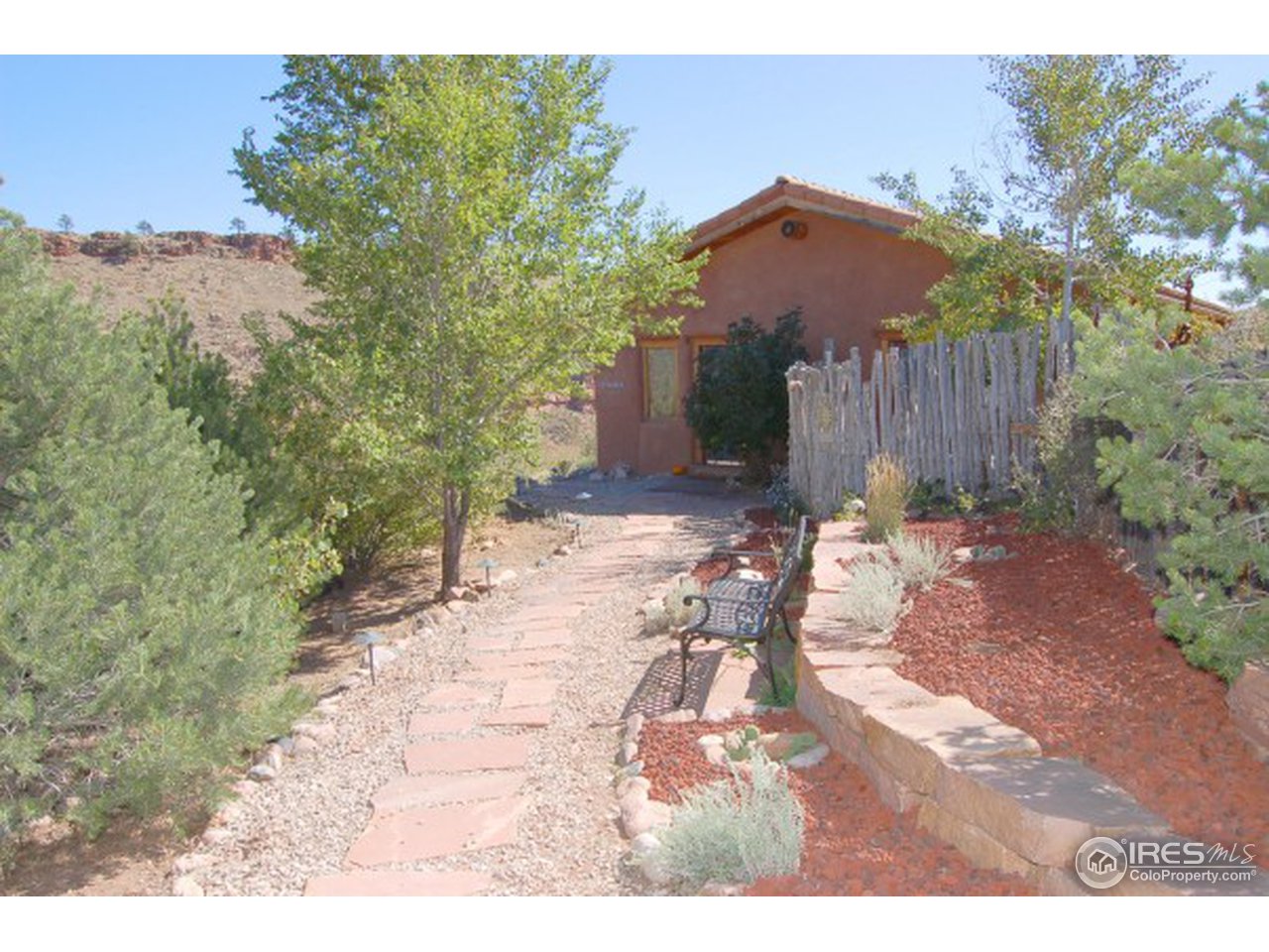 1016 Vision Way Lyons, CO 80540 - Photo 9 of 13 a view of a backyard with wooden fence