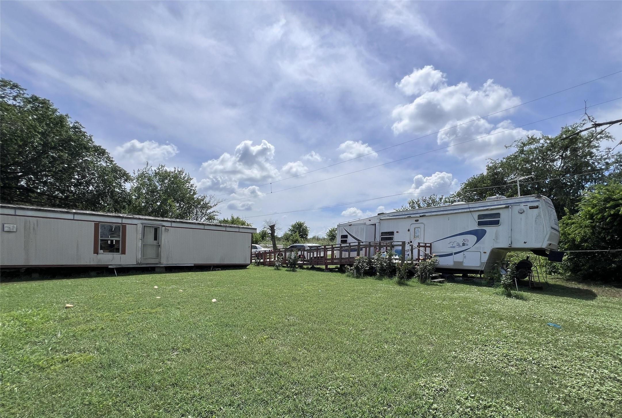 10001 Peterson Road Del Valle, TX 78617 - Photo 29 of 29 a view of a house with backyard sitting area and garden
