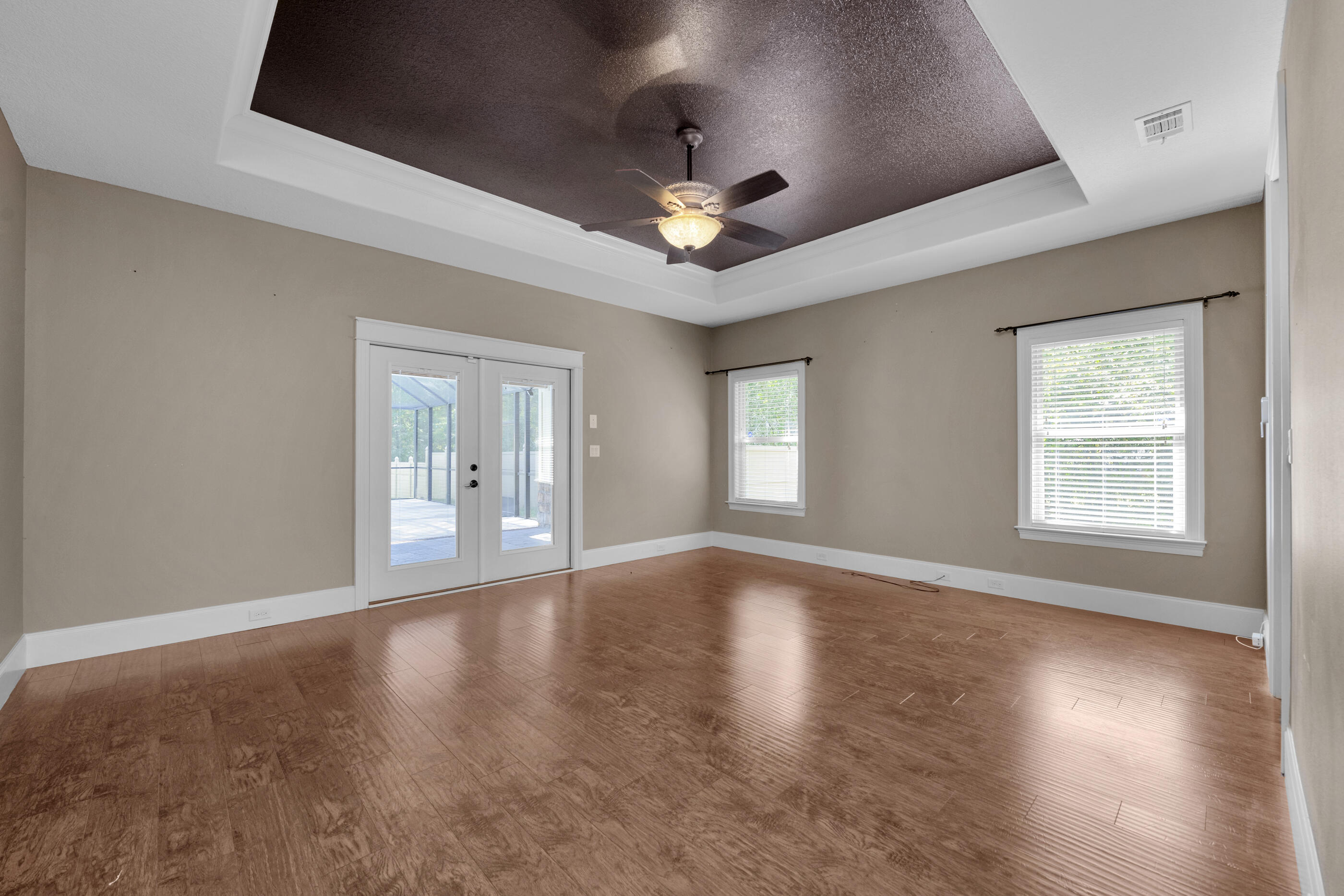 5601 Old River Road Baker, FL 32531 - Photo 14 of 45 a view of an empty room with a window and wooden floor