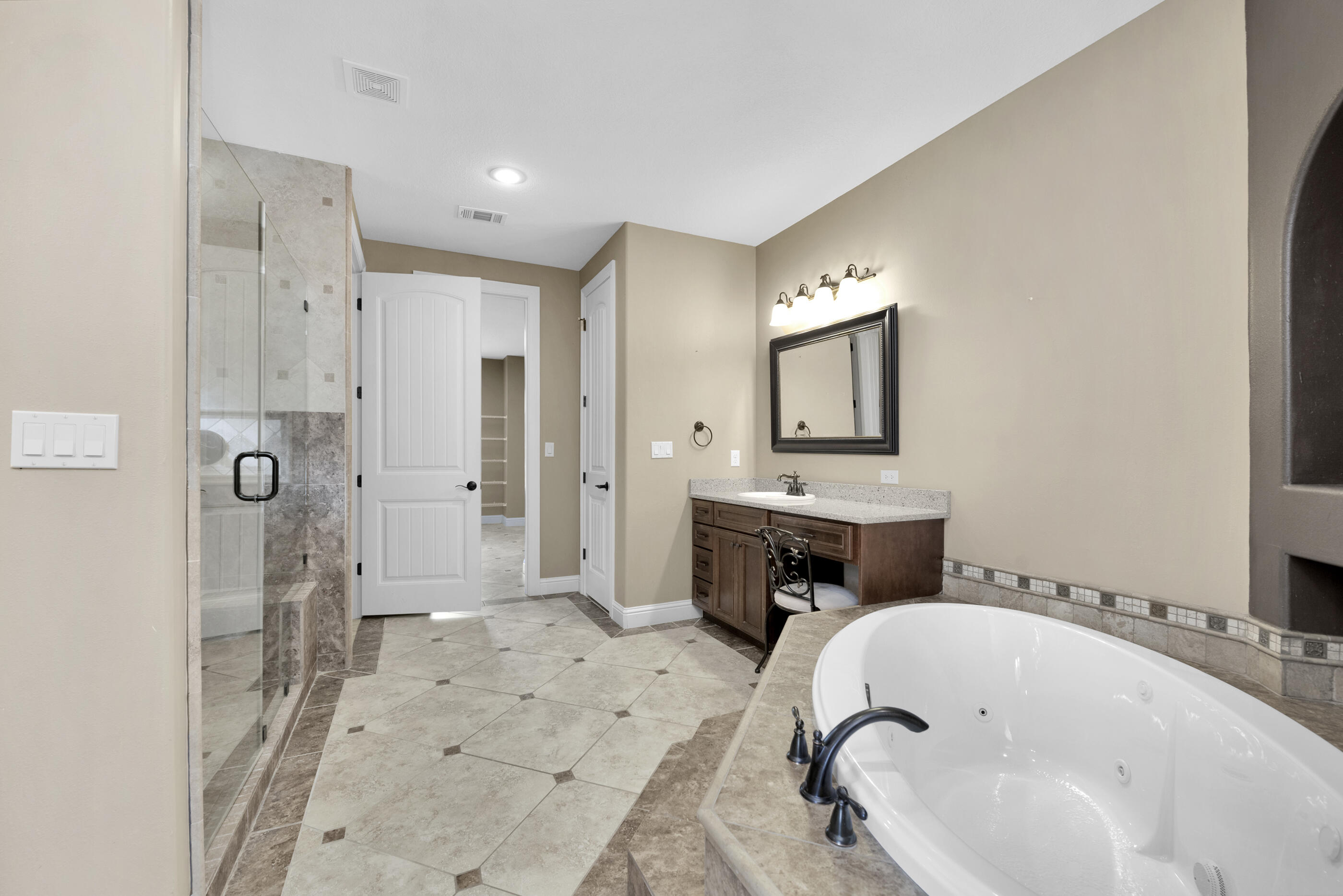 5601 Old River Road Baker, FL 32531 - Photo 17 of 45 a bathroom with a tub sink and mirror