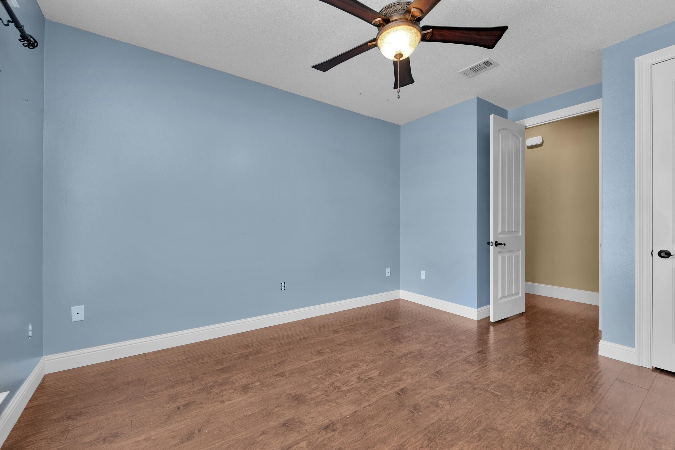 5601 Old River Road Baker, FL 32531 - Photo 23 of 45 an empty room with closet and a chandelier fan