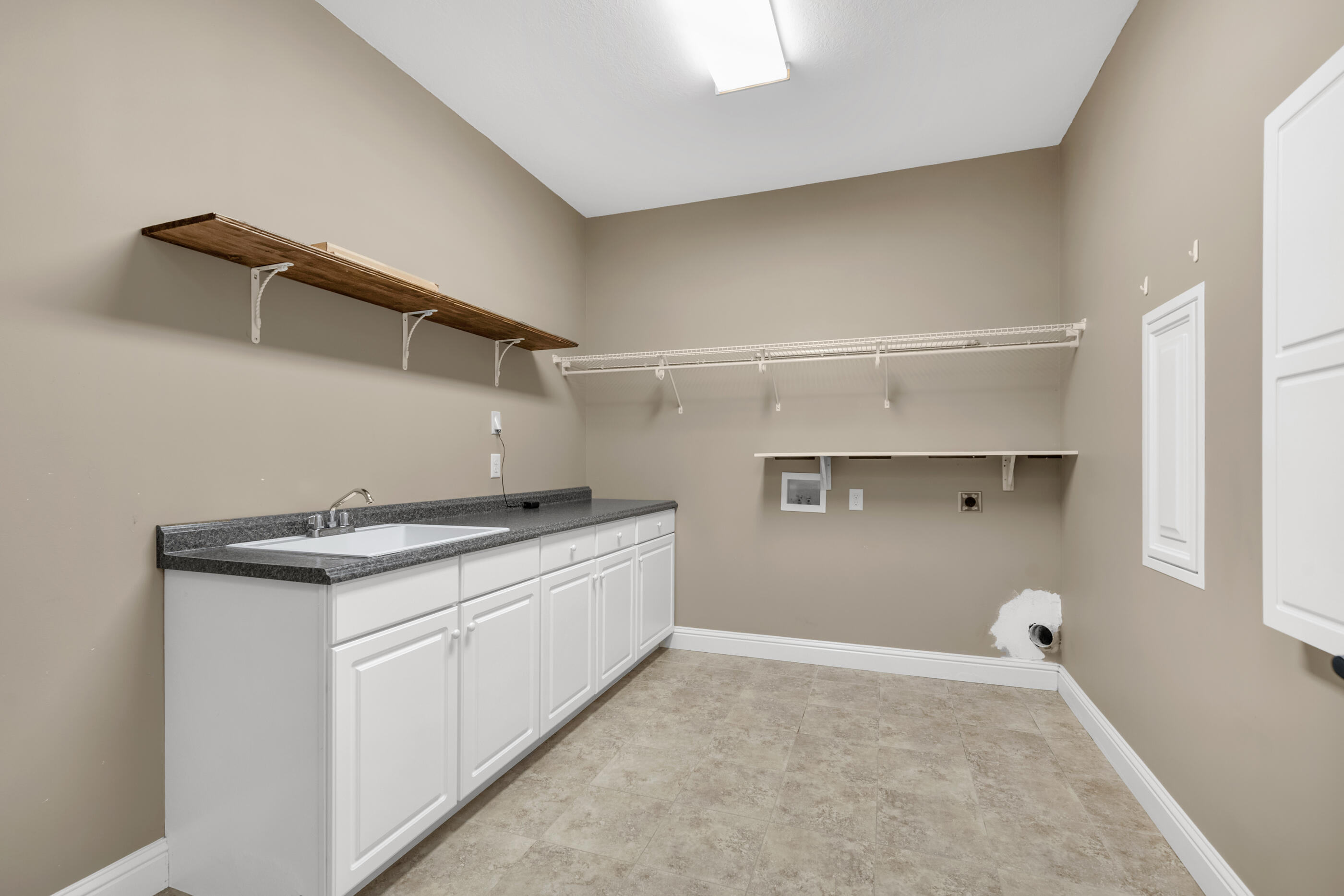 5601 Old River Road Baker, FL 32531 - Photo 33 of 45 a utility room with cabinets