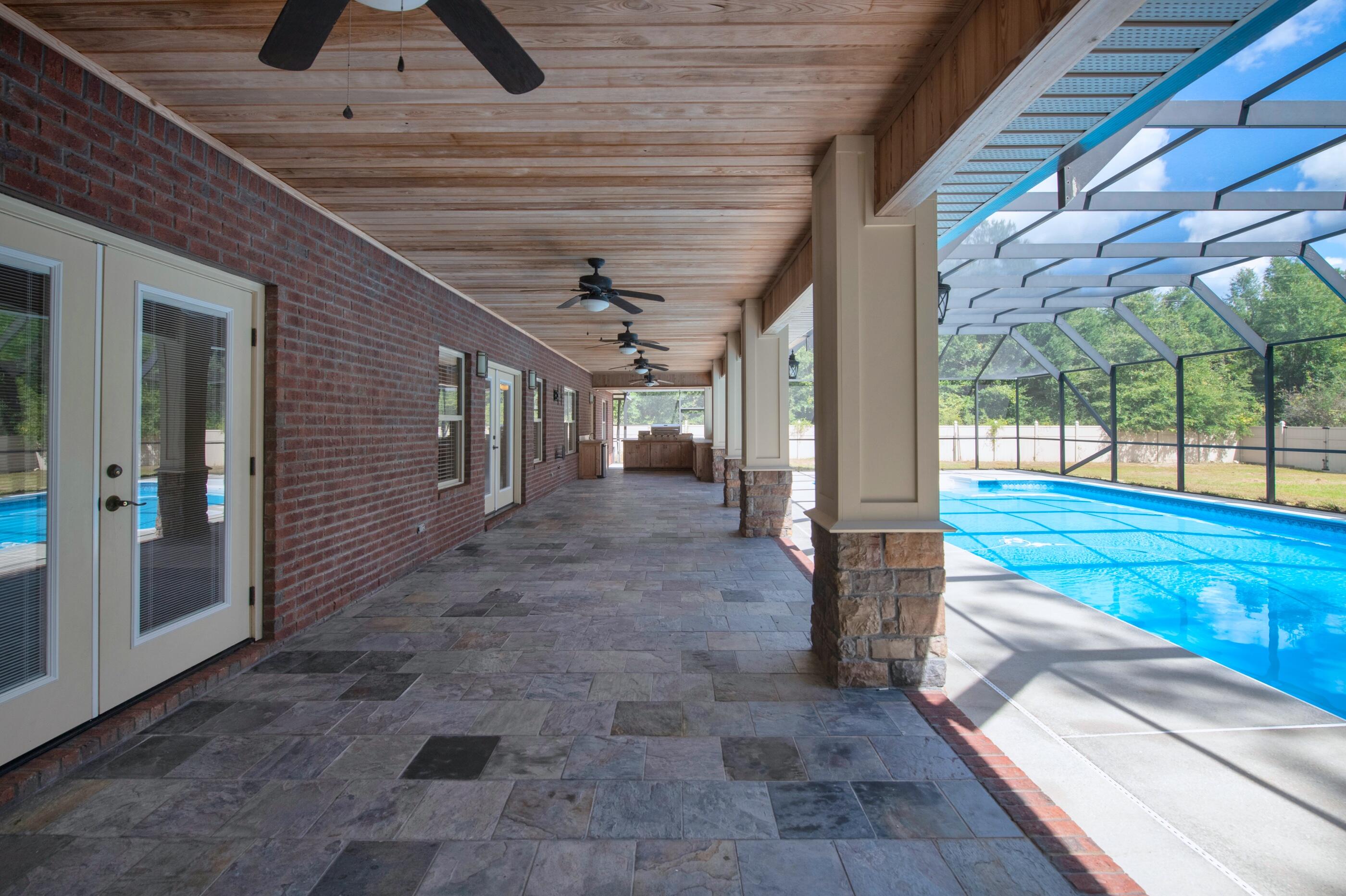 5601 Old River Road Baker, FL 32531 - Photo 36 of 45 a view of a porch with a backyard