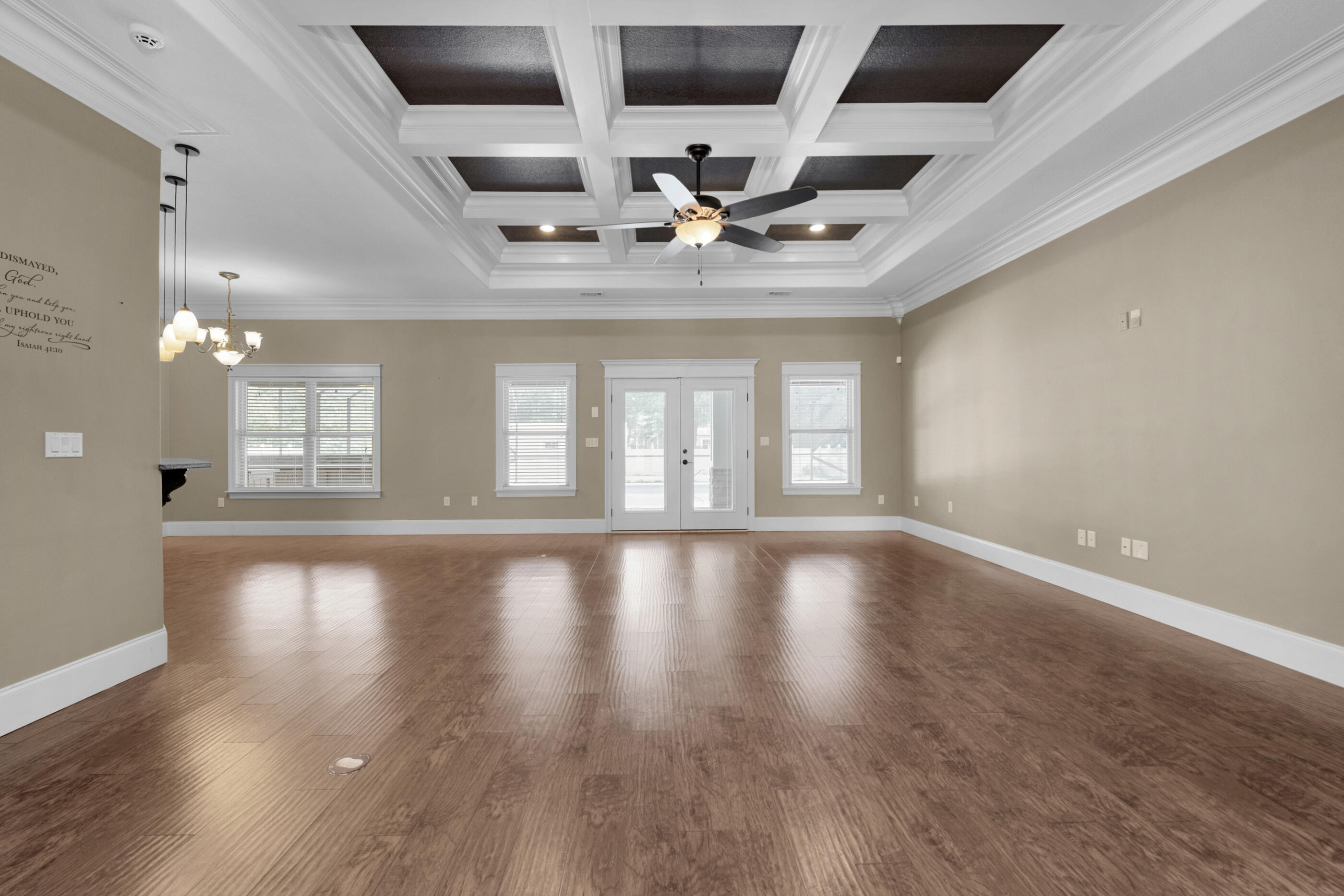 5601 Old River Road Baker, FL 32531 - Photo 9 of 45 a view of an empty room with wooden floor and a ceiling fan