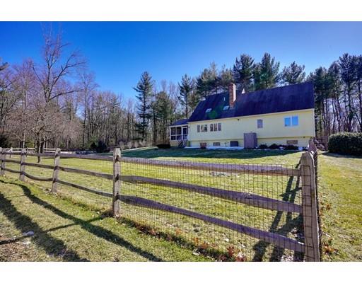 371 Sargent Road Boxborough, MA 01719 - Photo 24 of 30 a view of swimming pool with outdoor seating and house in the background